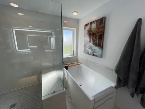 Finished marble master bathroom by Green Light Works