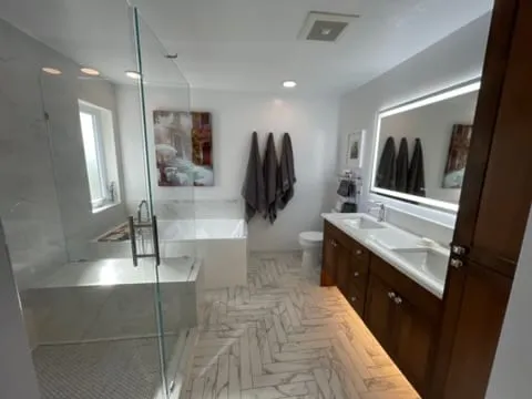 Finished master bathroom with tub and vanity