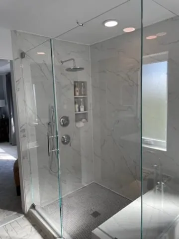 Finished marble walk-in glass shower