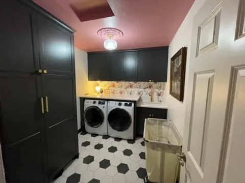 Finished laundry room with hex tile floor