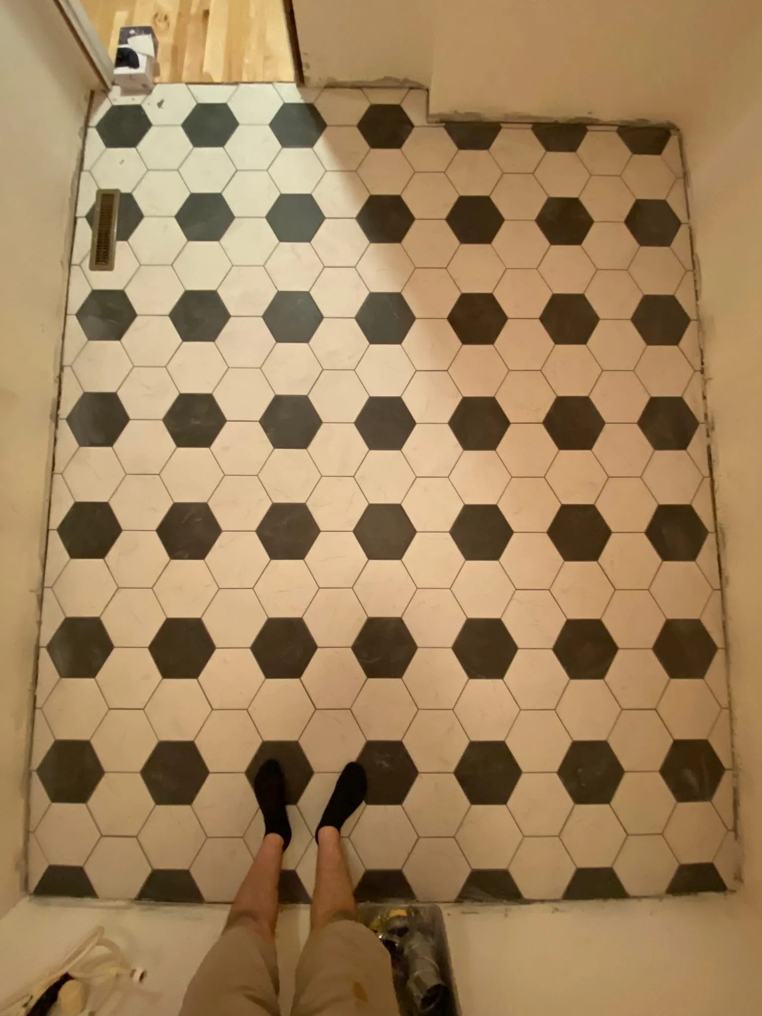 Old black and white hex tile floor