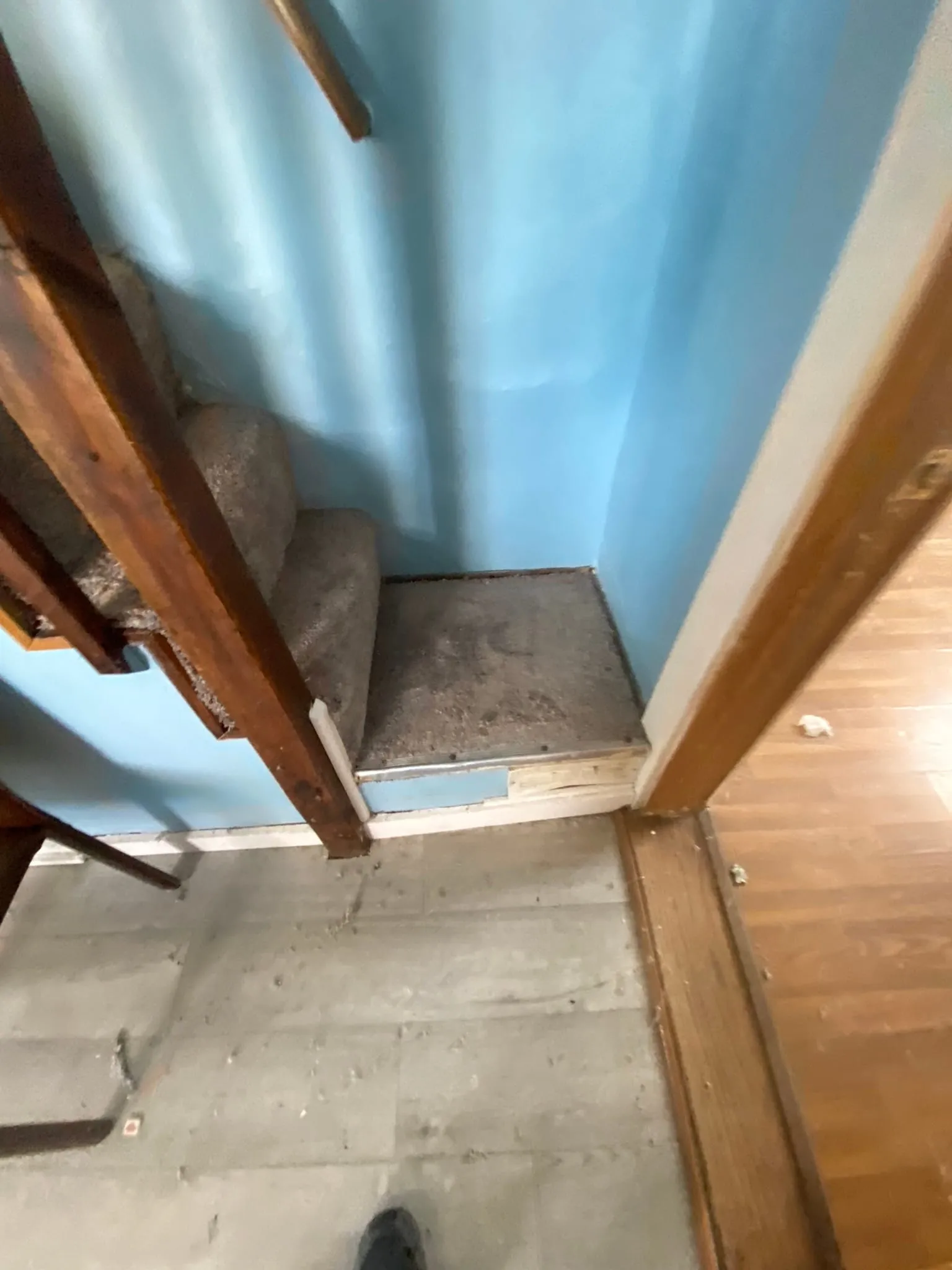Stair landing carpet removal in progress