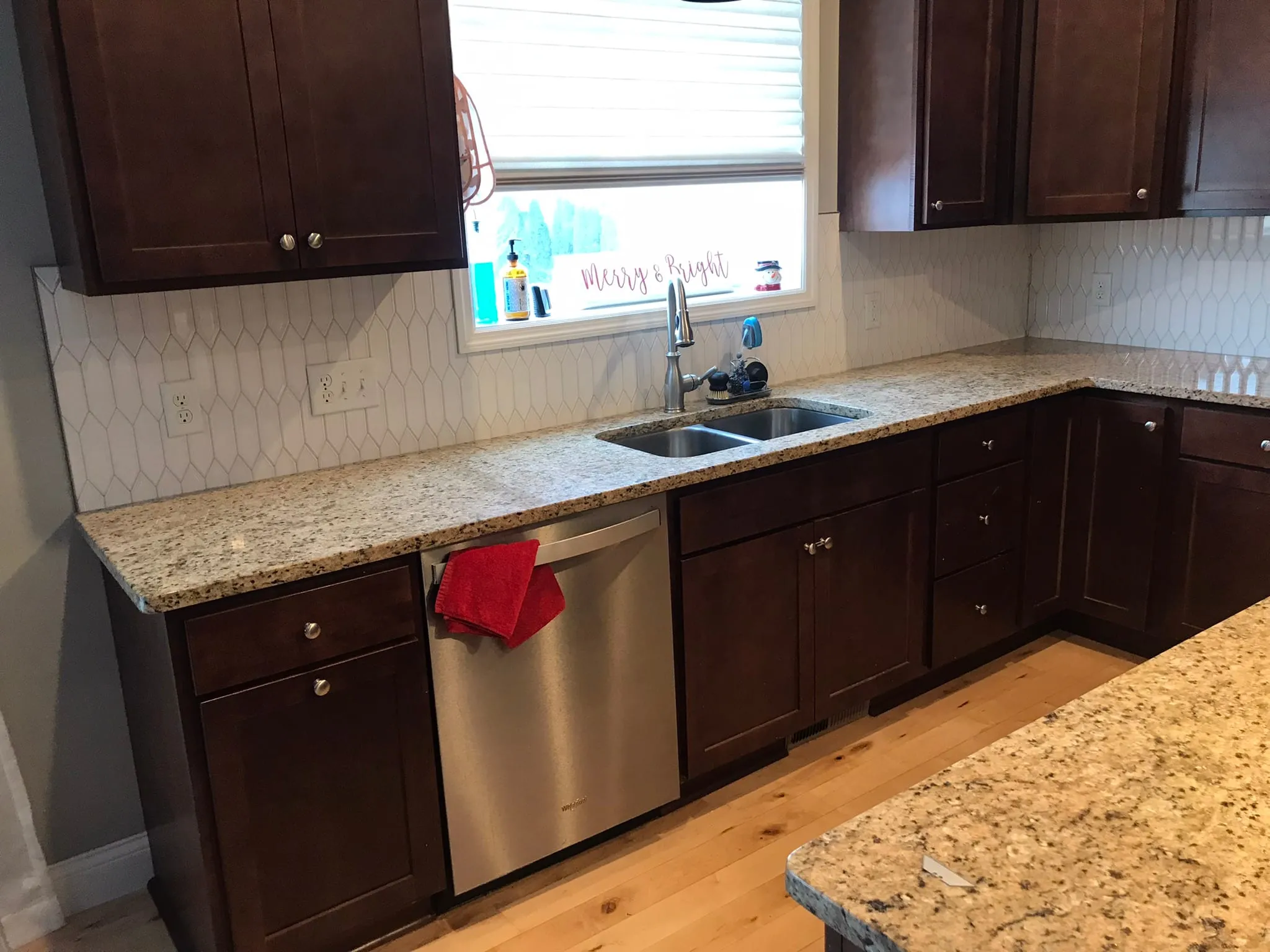 Finished white picket backsplash with granite counters