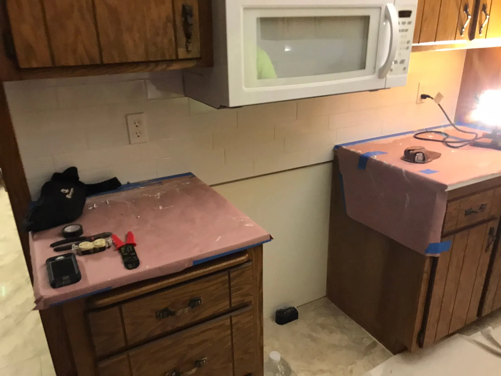 Subway backsplash install with covered counters