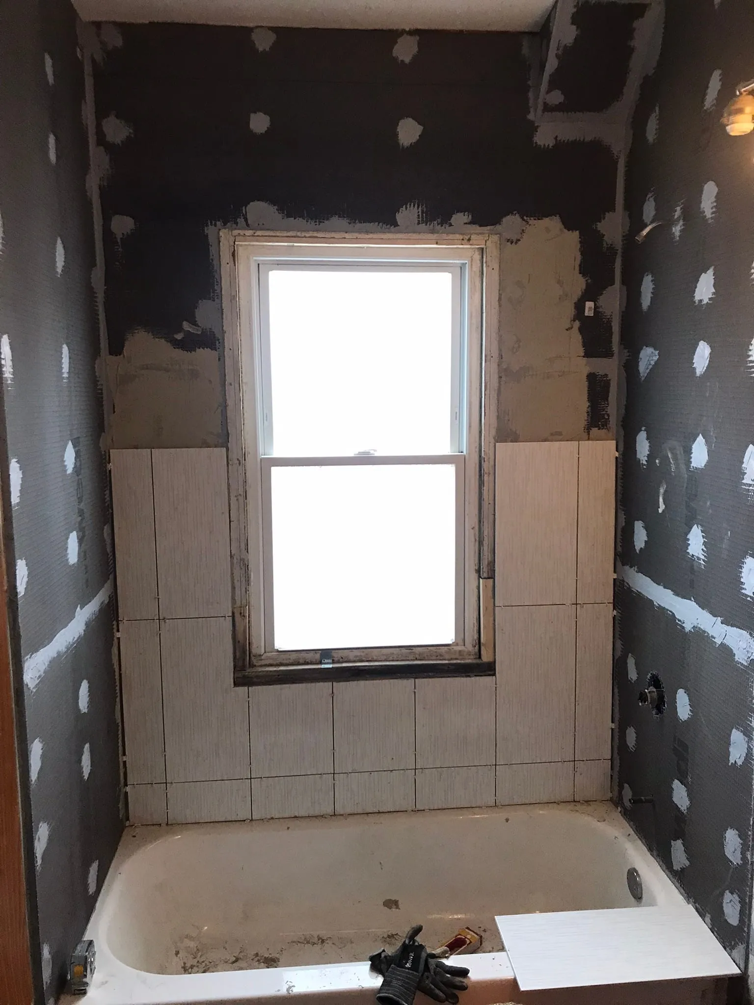 Early tub surround tiling over backer board